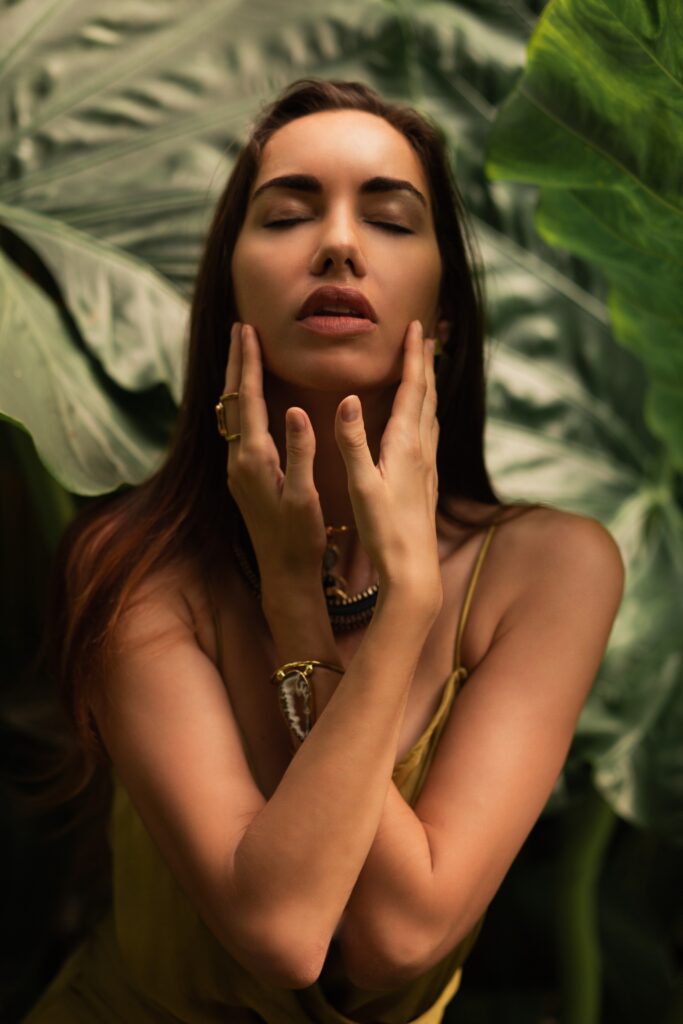 woman elegant silk dress posing tropical rainy tropical forest